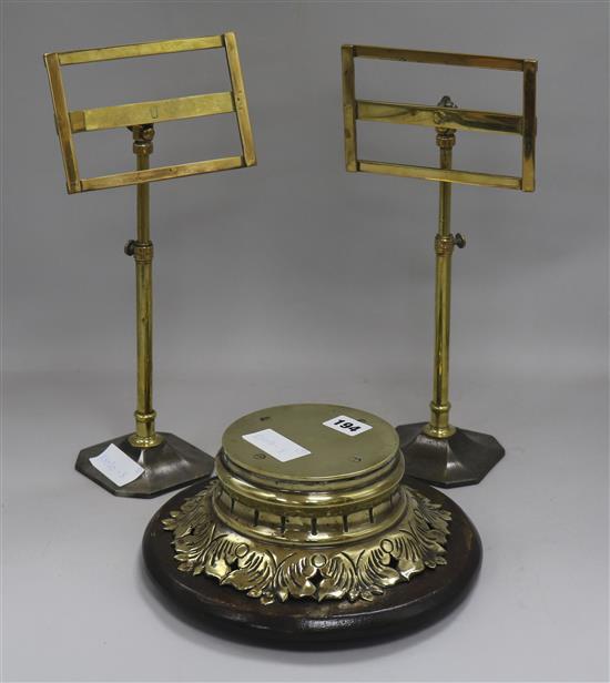 A pair of telescopic stands and a brass stand tallest 35cm